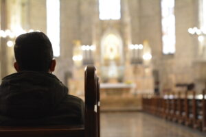 Man sitting in Catholic Church